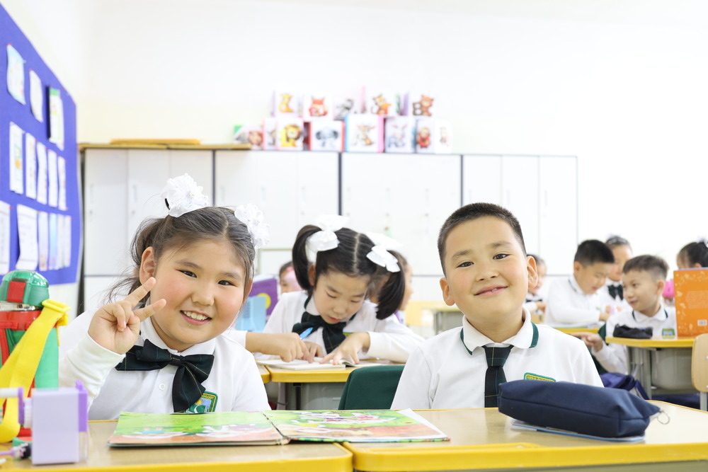 Child laughing with teacher